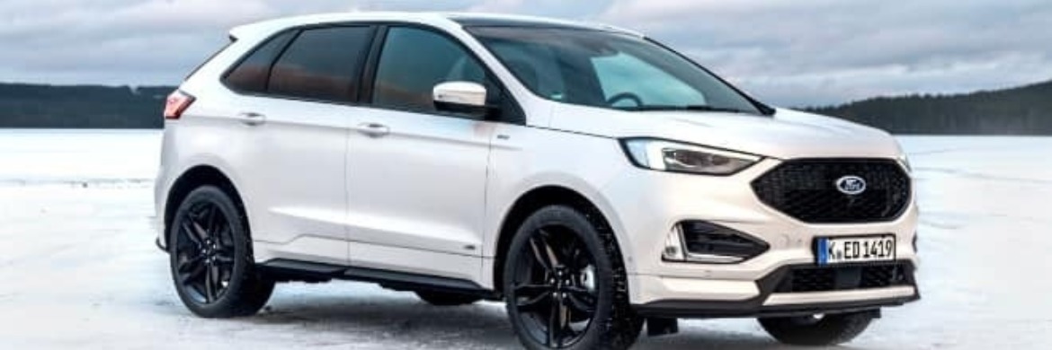 White New Ford Edge on ice